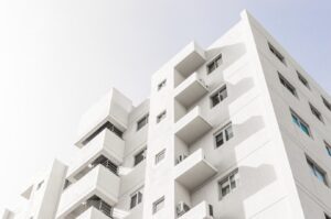 low angle shot facade white modern building blue clear sky 181624 48219