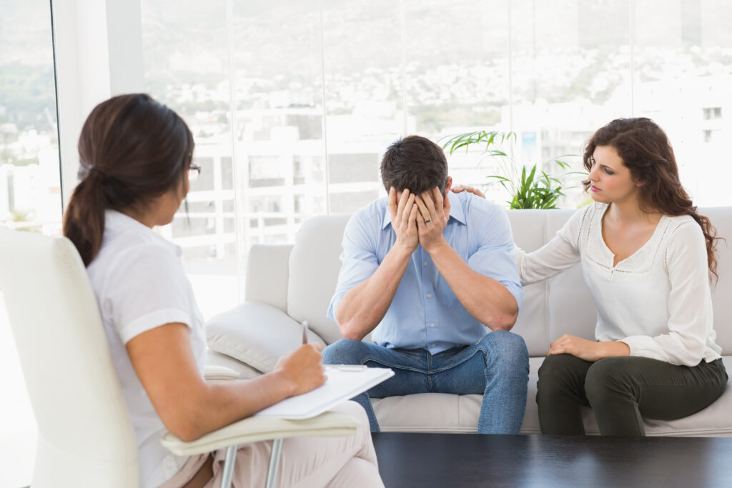 depressed couple talking with their therapist