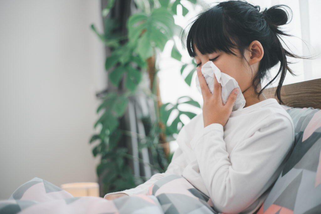 little girl gets cold blows her nose home