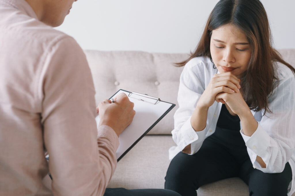 women asian patients with man psychologist examination consulting