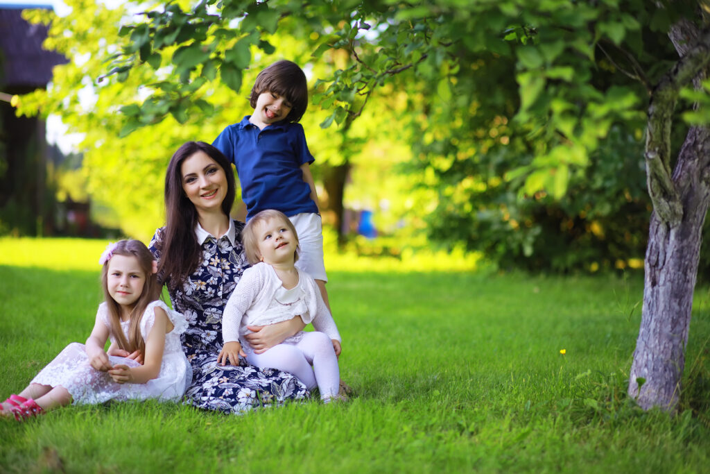 young large family summer morning walk beautiful mother with children is playing park